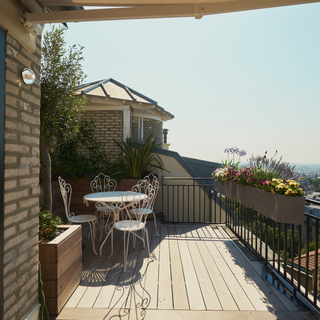 A Scenic Terrace Adds Extra Light and Living Space To This 323-Square-Foot Apartment